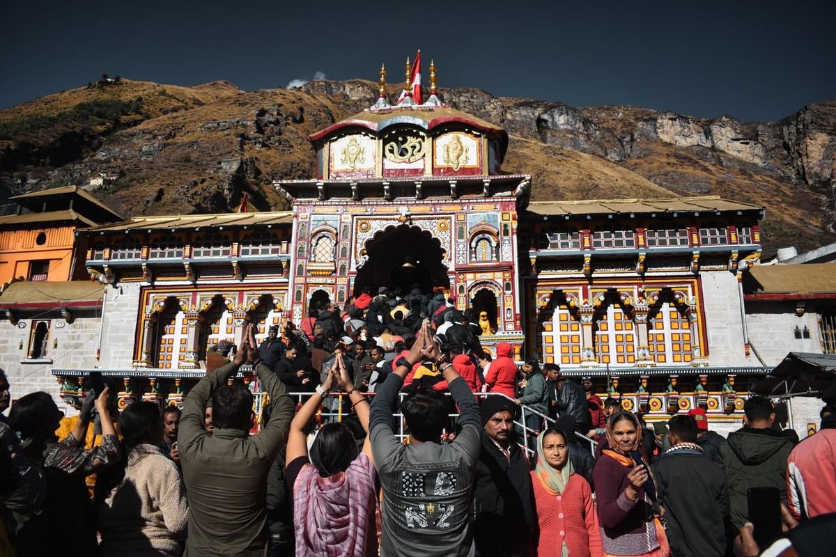 Devotees at Badrinath temple with Char Dham registration passes