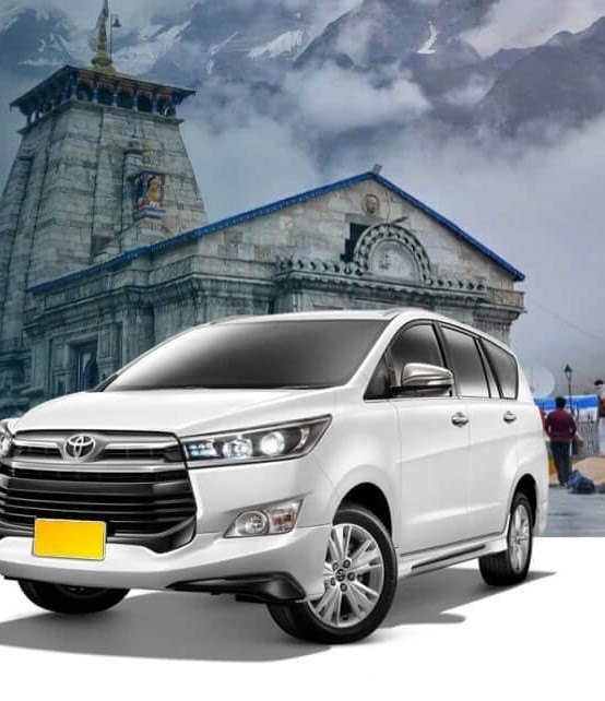 Innova Crysta in front of Kedarnath temple on an outstation taxi Noida hill trip